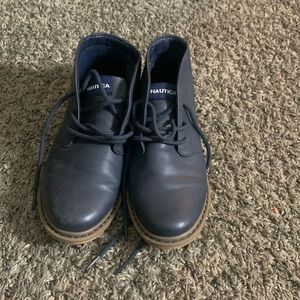 They are navy blue with tan soles, brand Nautica